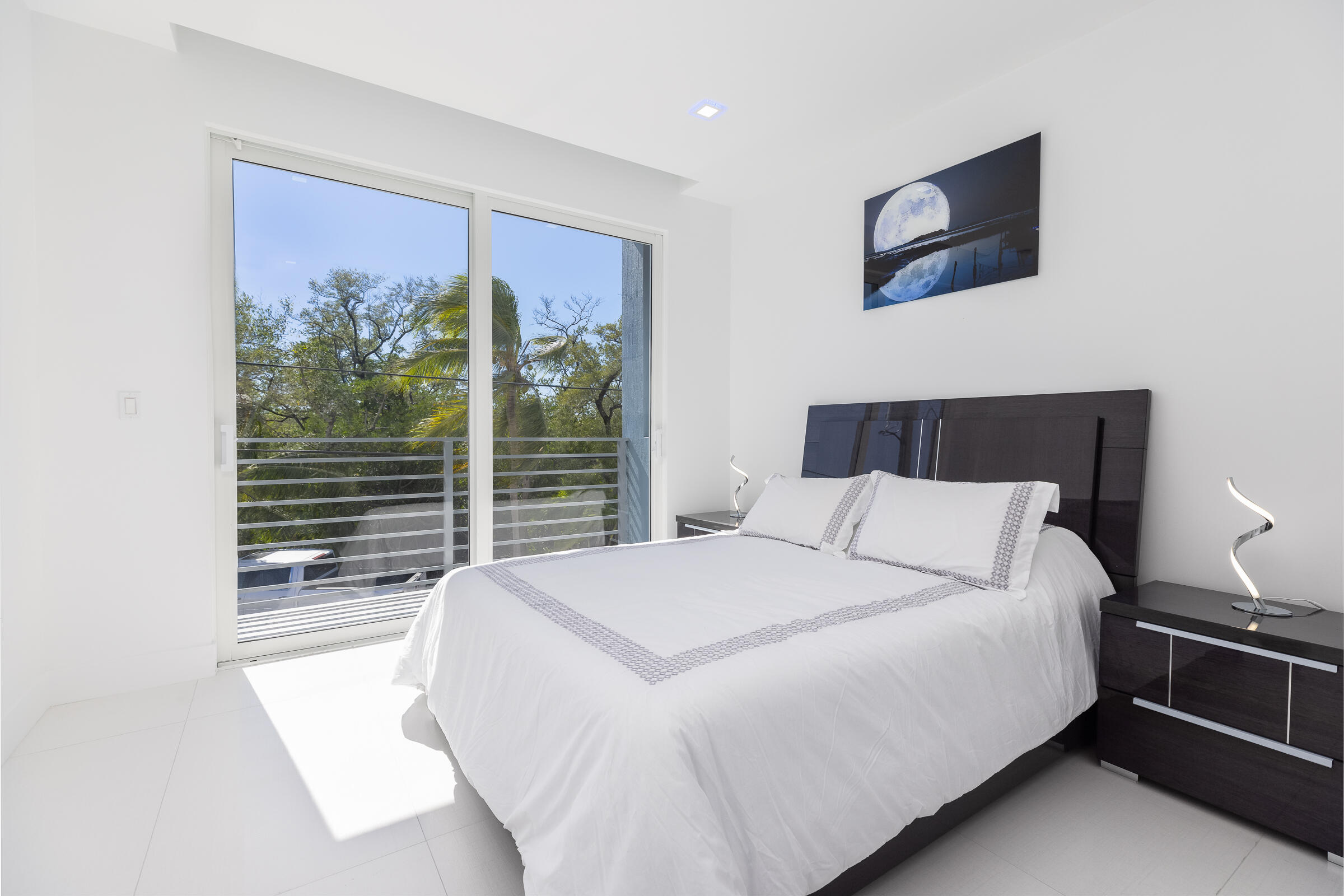 45 Cormorant Drive Key Largo, FL 33037 - Photo 32 of 51 a large bed sitting in a bedroom next to a window