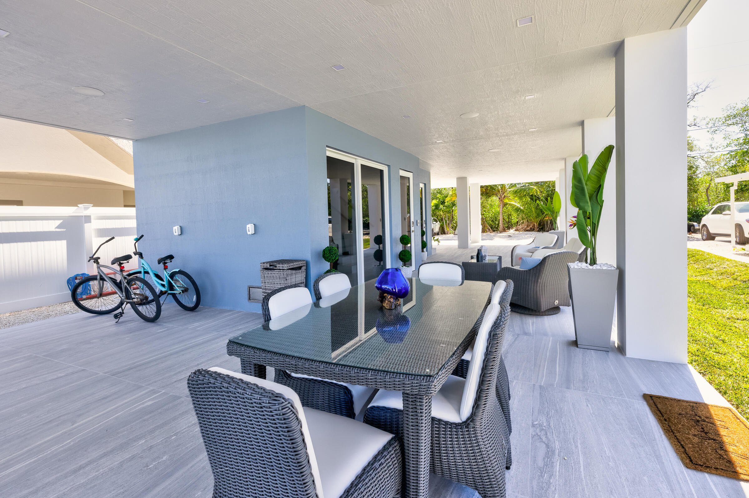 45 Cormorant Drive Key Largo, FL 33037 - Photo 42 of 51 a view of a dining room with furniture a potted plant and wooden floor