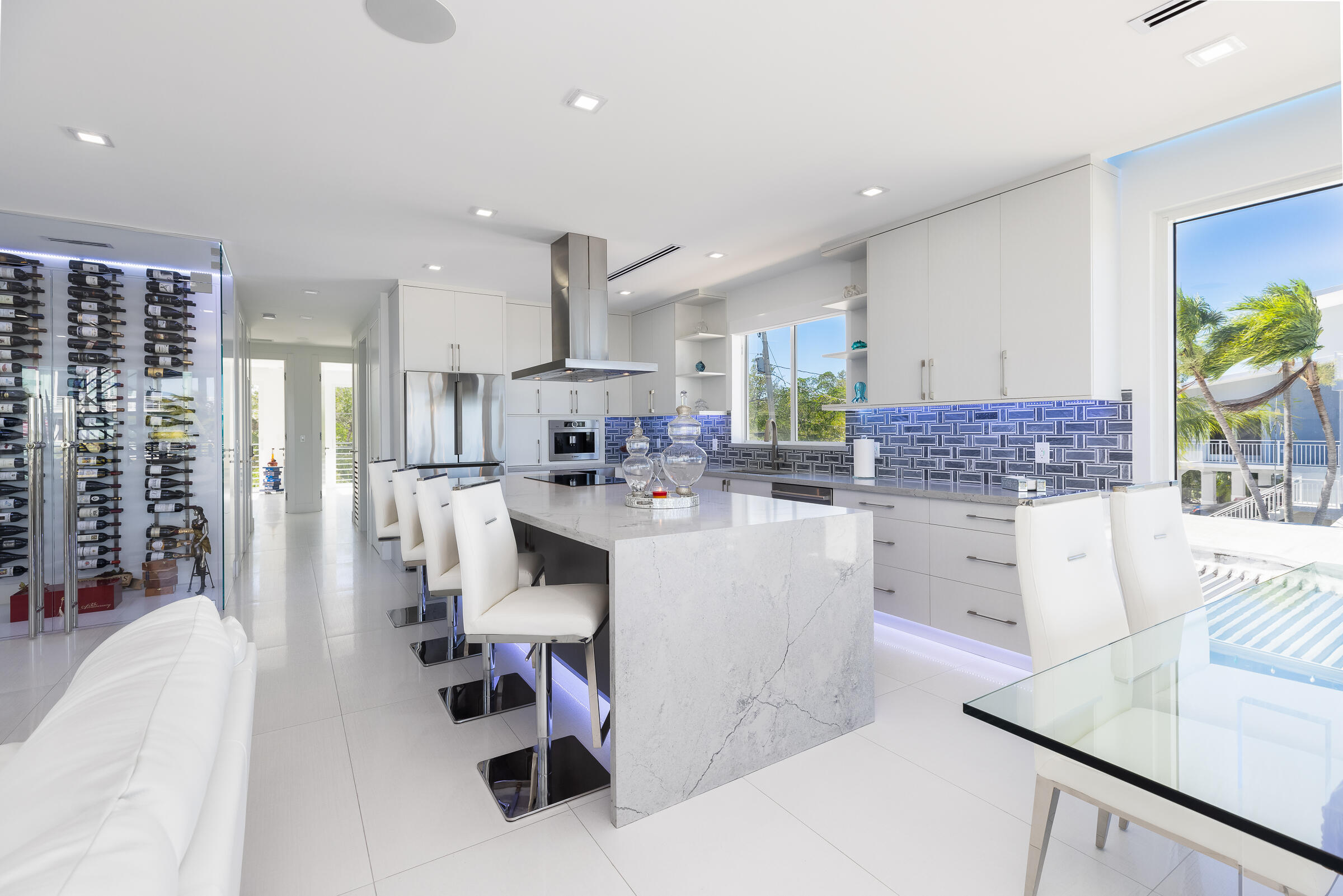 45 Cormorant Drive Key Largo, FL 33037 - Photo 10 of 51 a living room with stainless steel appliances kitchen island granite countertop furniture and a view of living room