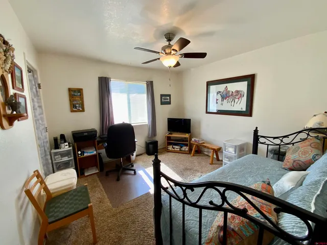 a view of a livingroom with furniture and a flat screen tv