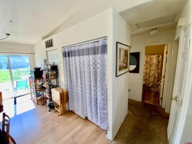 a view of a workspace with furniture and entryway