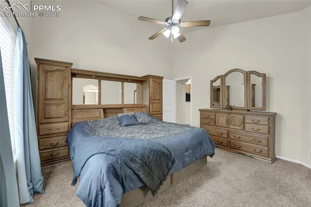 a bedroom with a bed and a dresser
