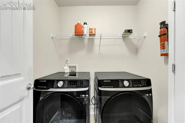 a utility room with dryer and washer