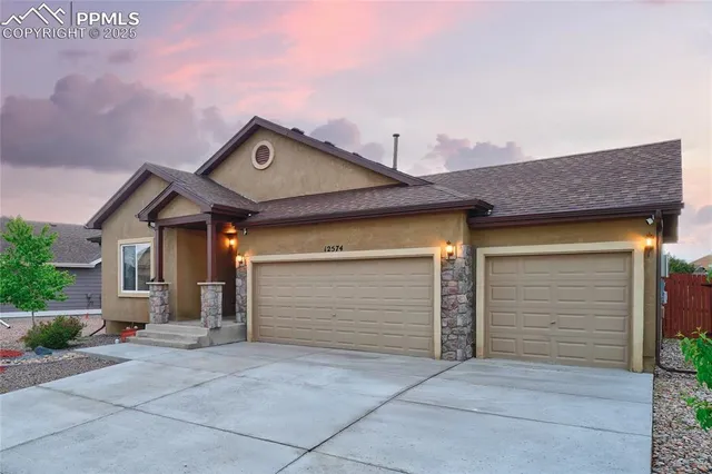 a front view of a house with a garage