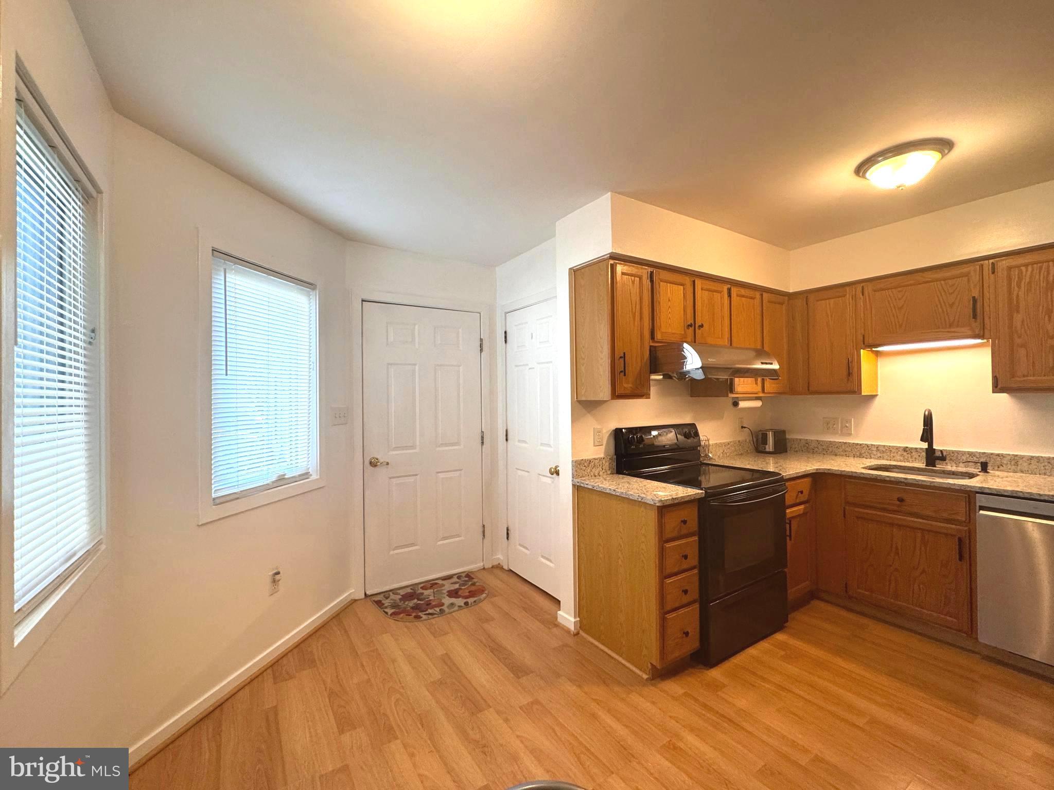 363 Chickory Way Newark, DE 19711 - Photo 11 of 42 a kitchen with stainless steel appliances granite countertop a stove and a sink