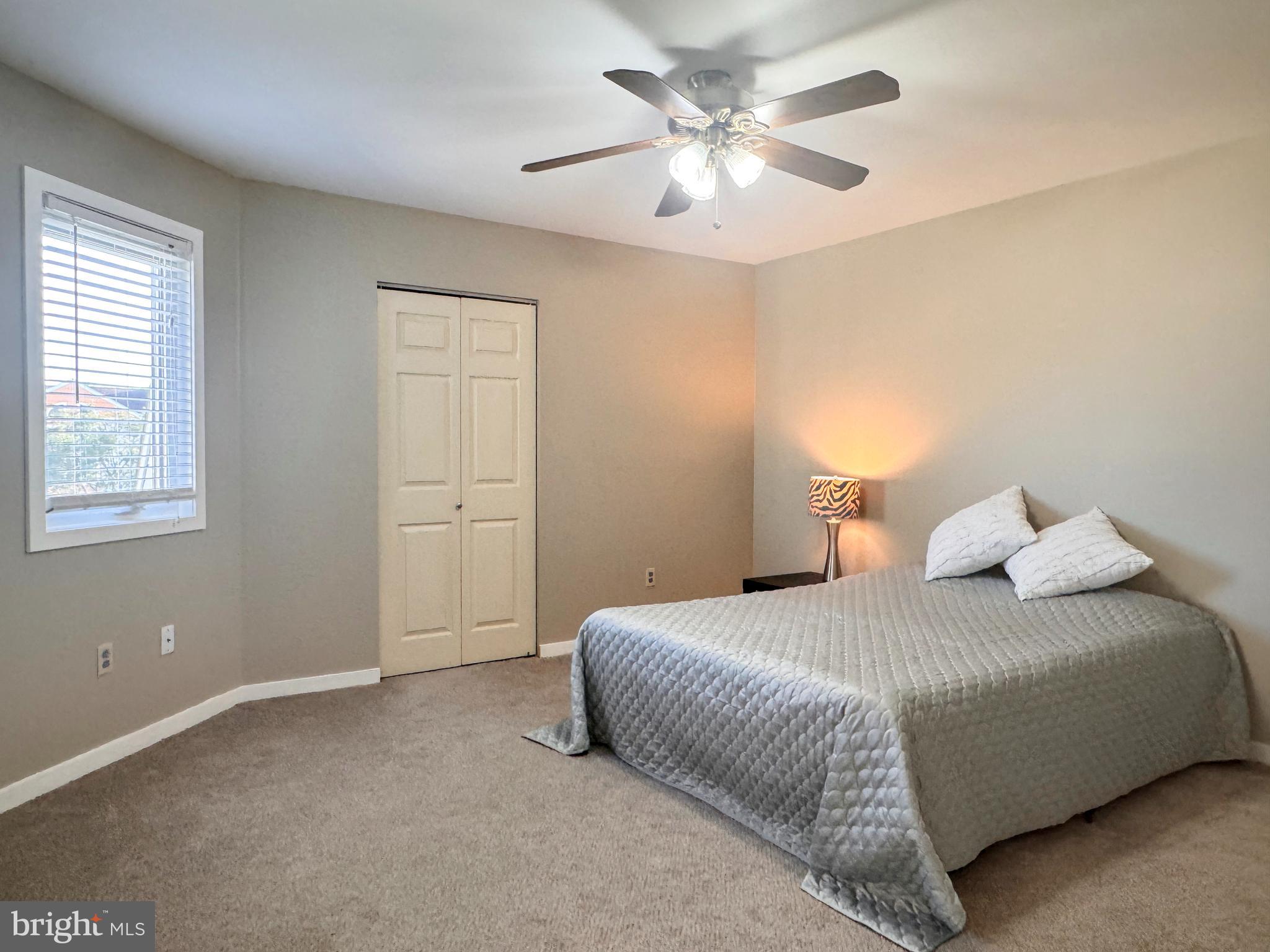 363 Chickory Way Newark, DE 19711 - Photo 17 of 42 a bedroom with a large bed with a chandelier