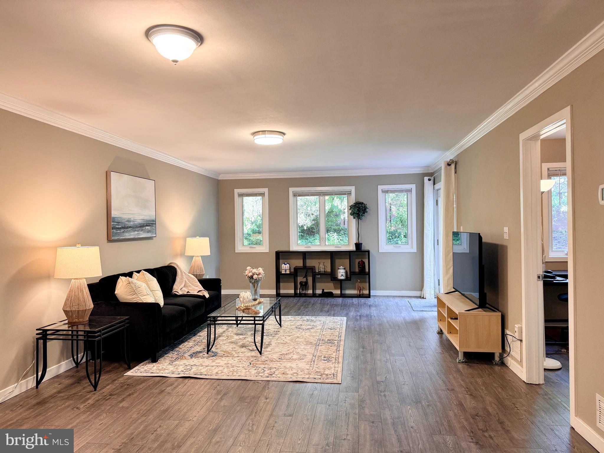 363 Chickory Way Newark, DE 19711 - Photo 4 of 42 a living room with furniture and a flat screen tv with wooden floor