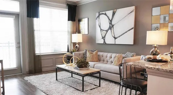 a living room with furniture and a window
