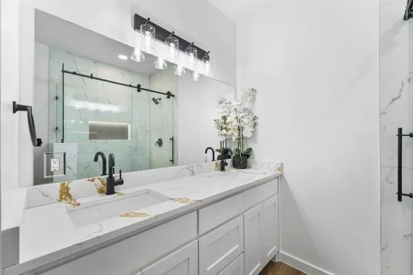 a bathroom with a sink and a mirror