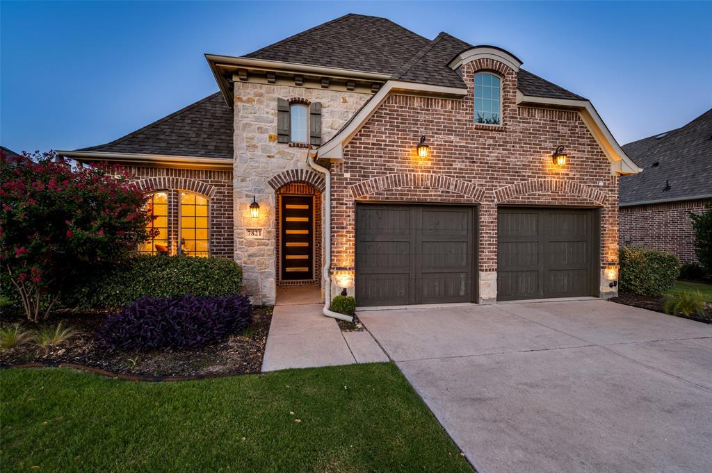 7821 Kentmere The Colony, TX 75056 - Photo 3 of 40 Stunning curb appeal welcomes you home with an elegant brick and stone elevation, beautifully landscaped grounds, and a sleek modern front door with glass inlays. Nestled on a quiet cul-de-sac, this exceptional residence offers timeless architecture, enhanced privacy, and an impressive first impression.