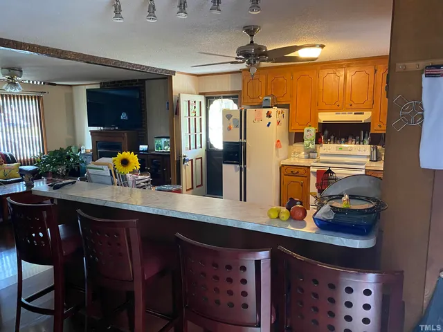 a kitchen with stainless steel appliances a sink and a refrigerator