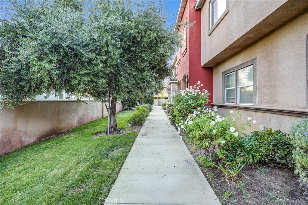 228 North Orange Avenue Rialto, CA 92376 - Photo 21 of 34 front view of a house with a pathway