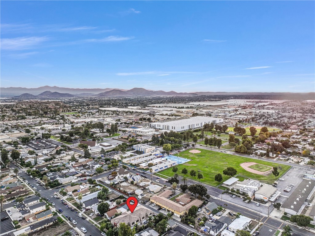 228 North Orange Avenue Rialto, CA 92376 - Photo 29 of 34 an aerial view of a houses with a yard