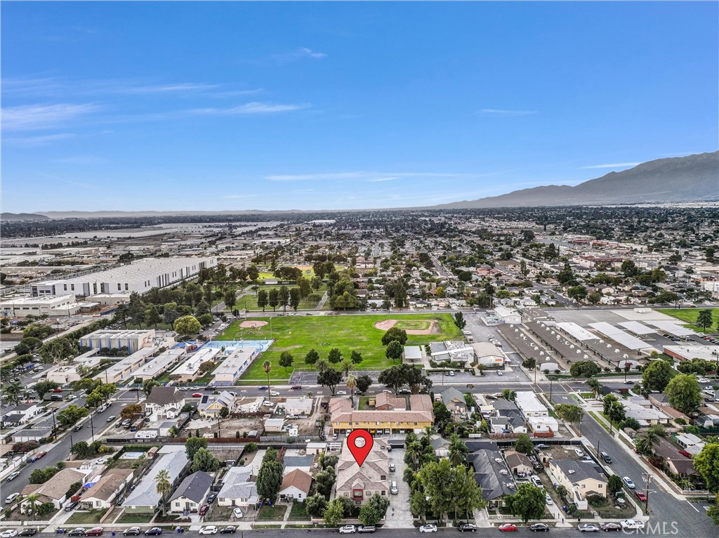 228 North Orange Avenue Rialto, CA 92376 - Photo 31 of 34 an aerial view of residential building and car parked