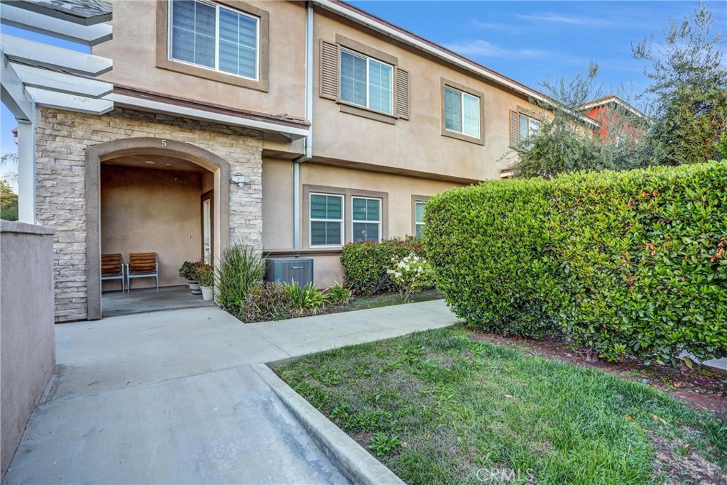 228 North Orange Avenue Rialto, CA 92376 - Photo 7 of 34 front view of a house with a yard