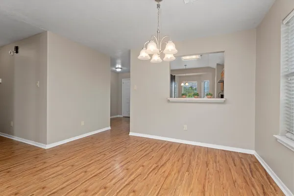 a view of empty room with fireplace and fan