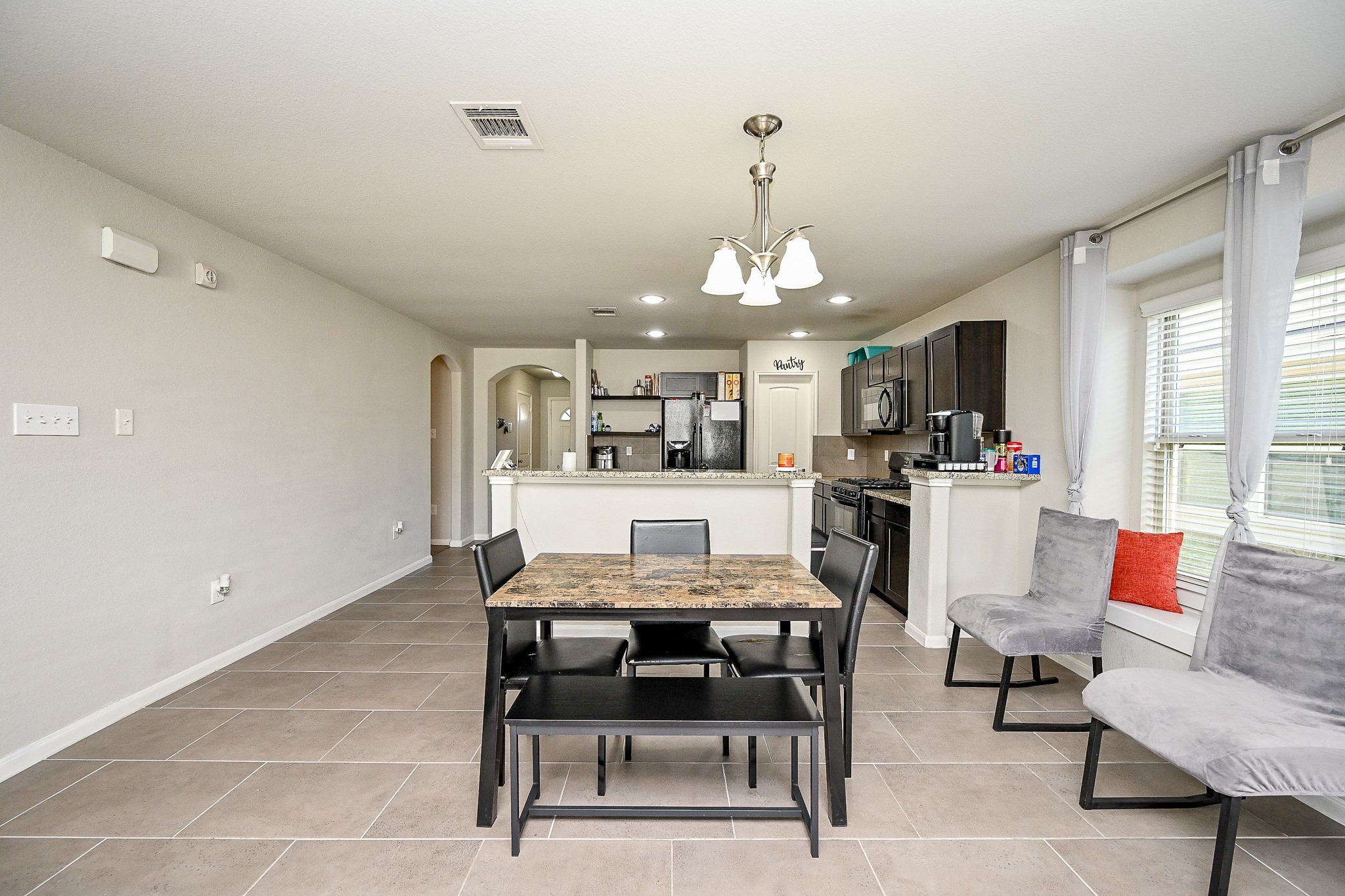 606 Palo ALto Court Rosharon, TX 77583 - Photo 11 of 23 a view of a dining room with furniture and a chandelier