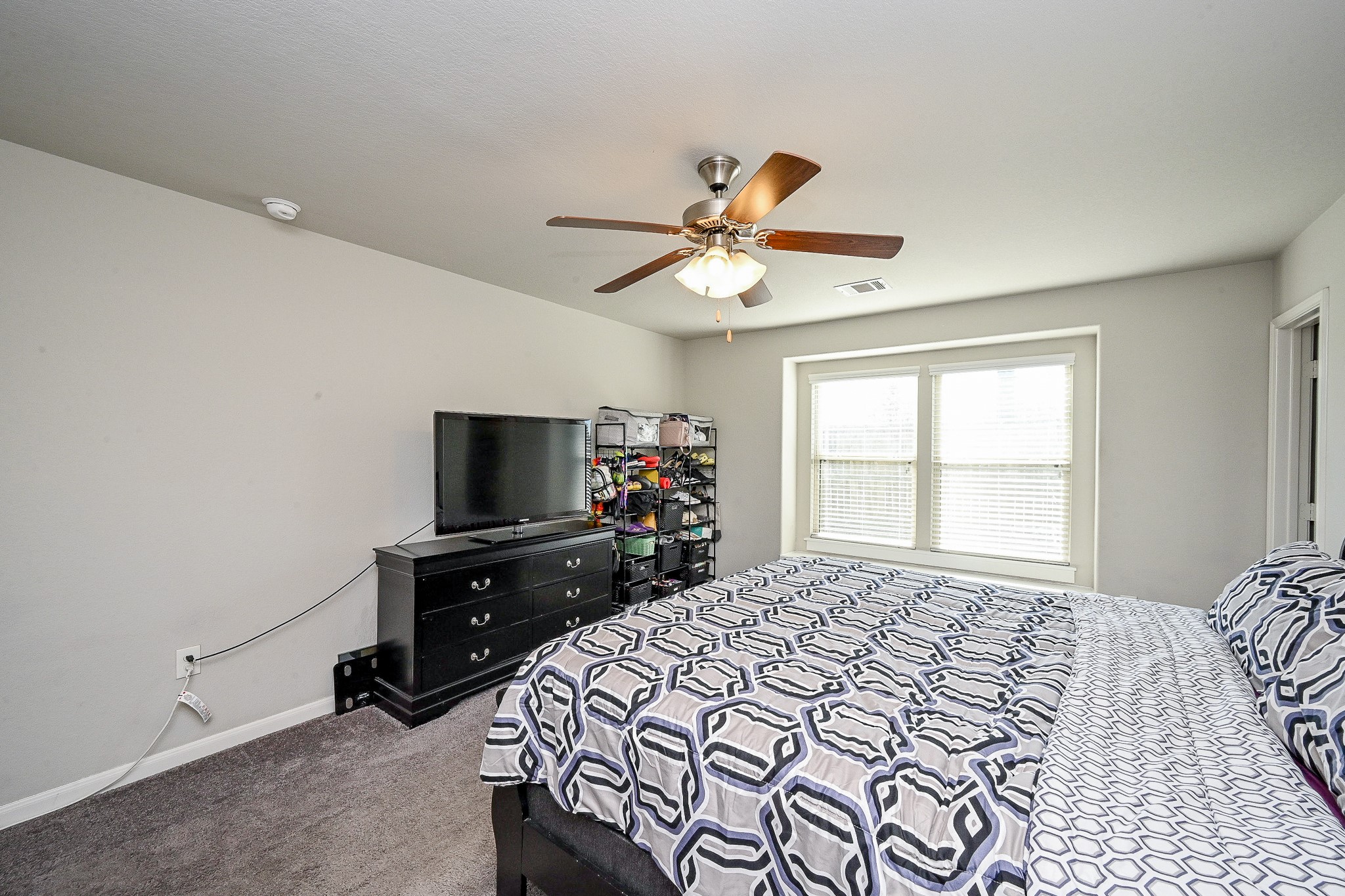 606 Palo ALto Court Rosharon, TX 77583 - Photo 16 of 23 a bedroom with a bed and a flat screen tv