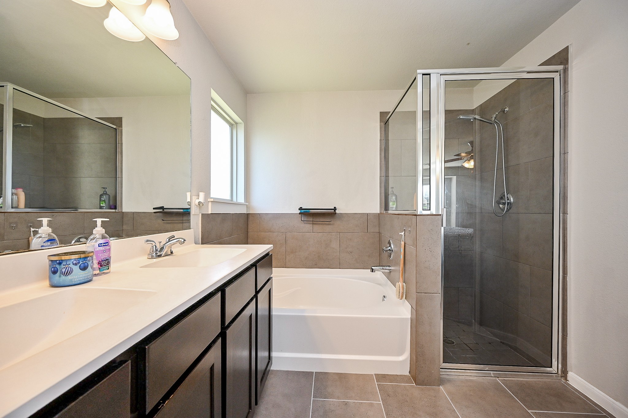 606 Palo ALto Court Rosharon, TX 77583 - Photo 17 of 23 a bathroom with a tub sink shower and a mirror
