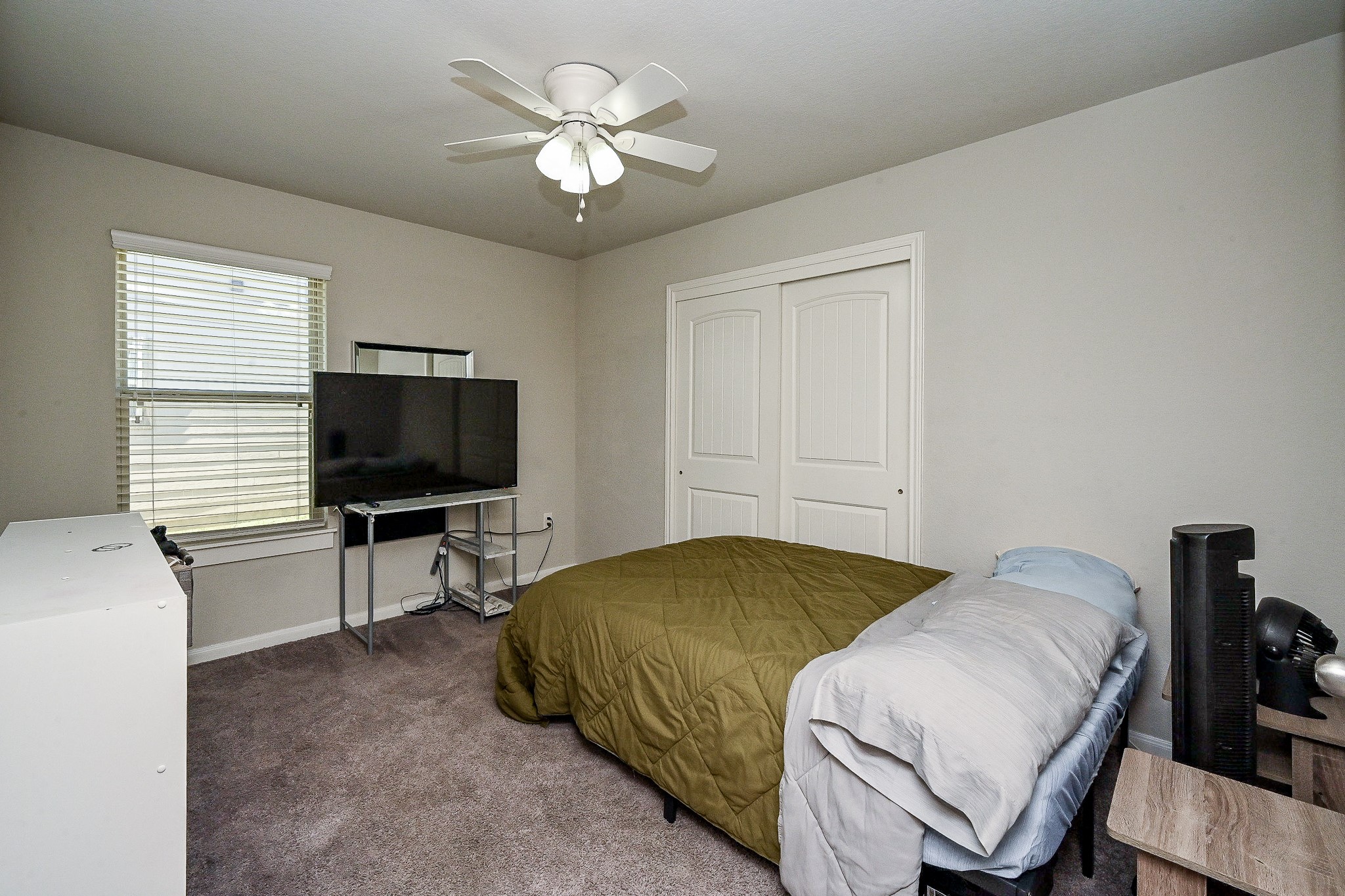 606 Palo ALto Court Rosharon, TX 77583 - Photo 18 of 23 a bedroom with a bed and a flat screen tv