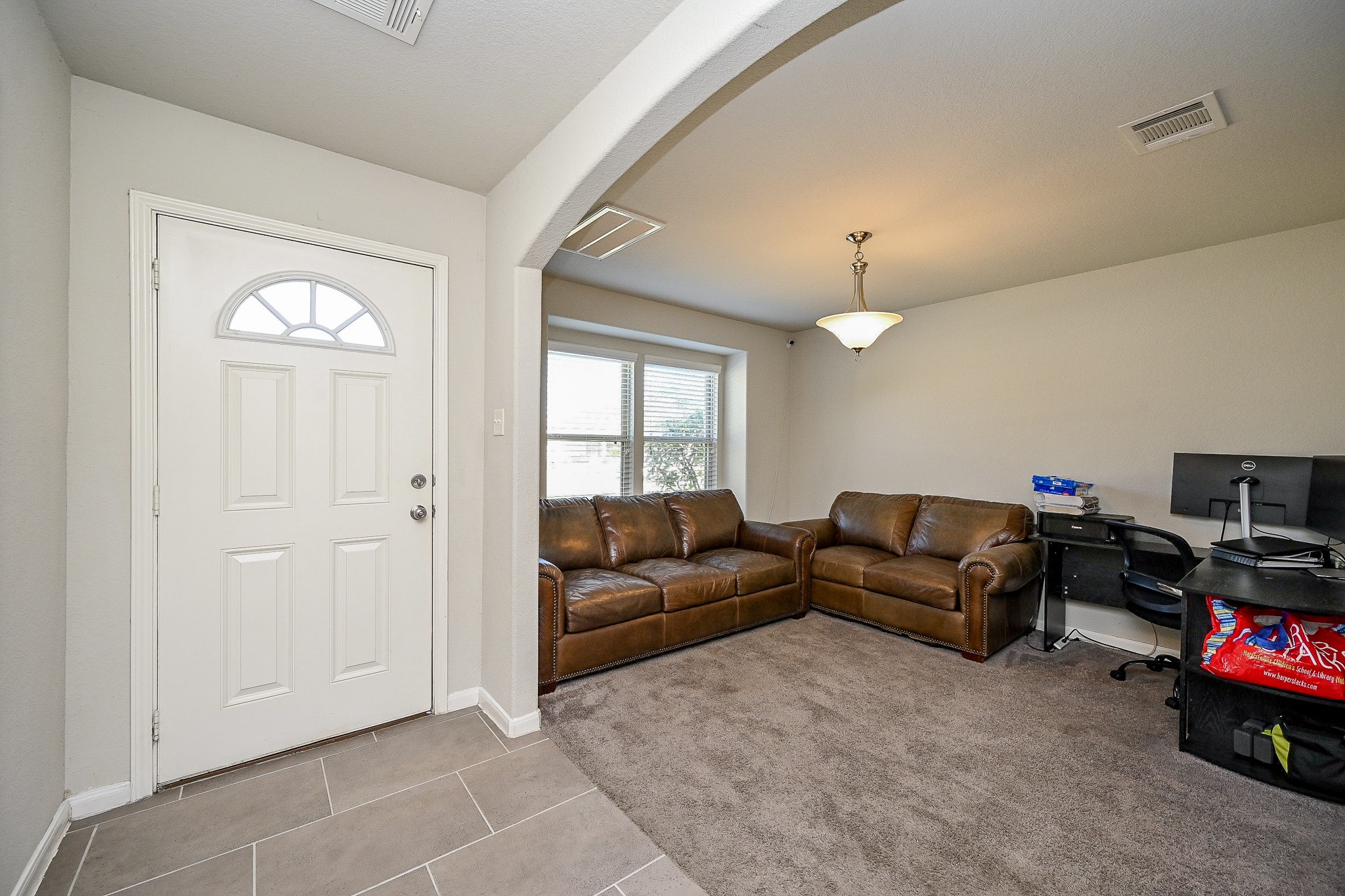 606 Palo ALto Court Rosharon, TX 77583 - Photo 5 of 23 a living room with furniture a window and a flat screen tv