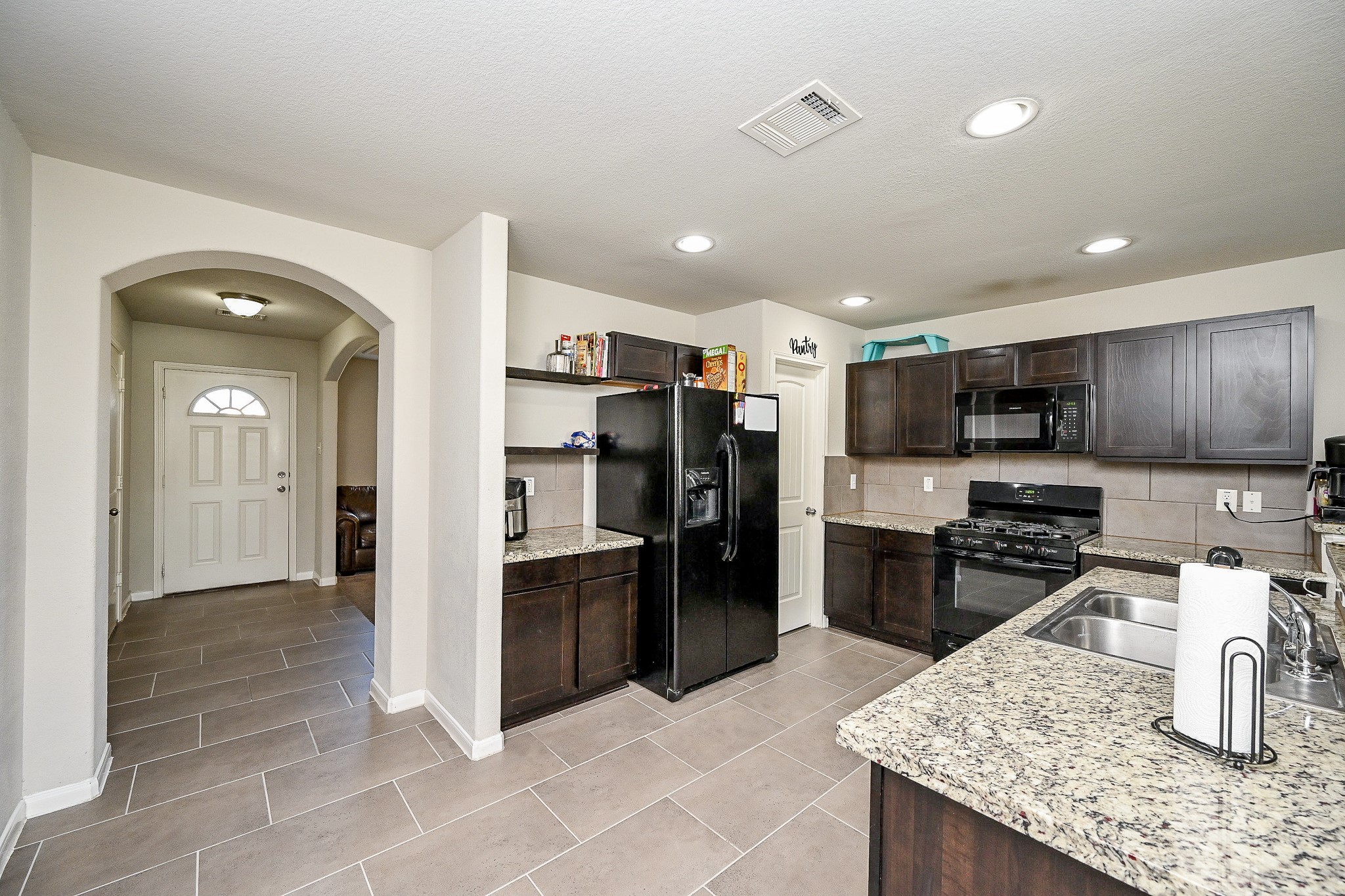606 Palo ALto Court Rosharon, TX 77583 - Photo 8 of 23 a kitchen with stainless steel appliances granite countertop a refrigerator and a sink