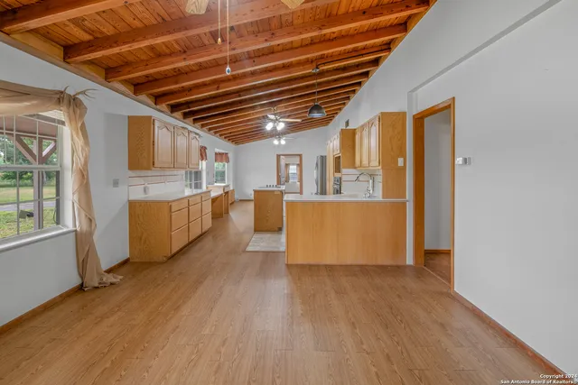 a view of a livingroom with wooden floor