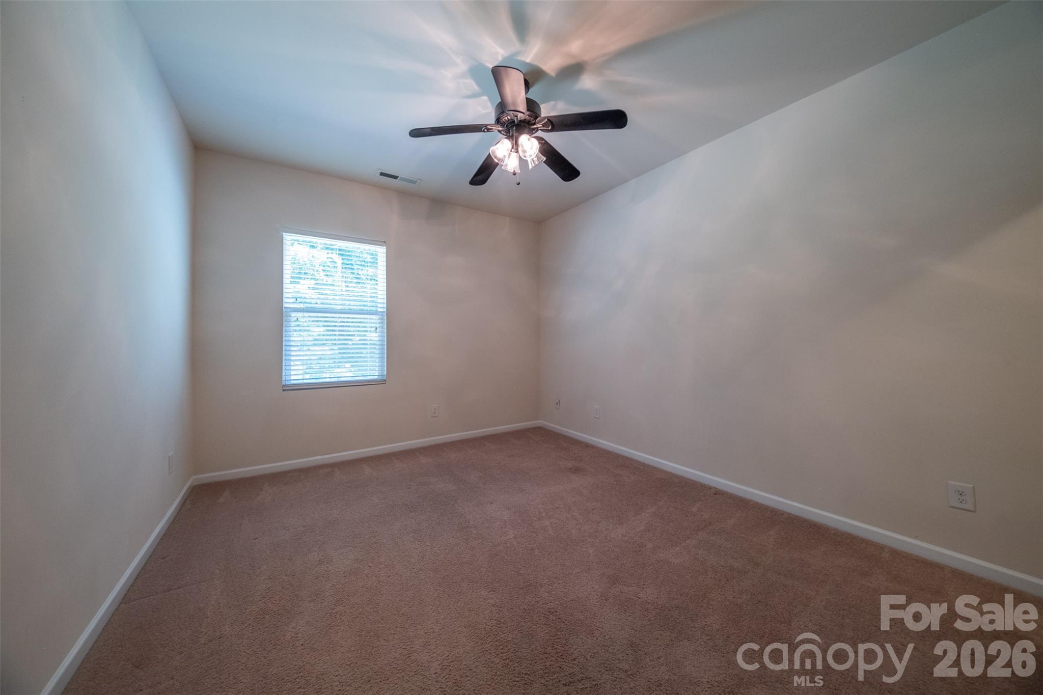 3006 Houndscroft Road Indian Trail, NC 28079 - Photo 19 of 39 an empty room with windows and fan
