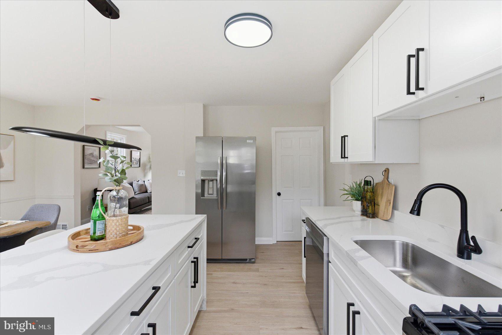 10 Mardrew Road Baltimore, MD 21229 - Photo 16 of 37 a kitchen with refrigerator and sink