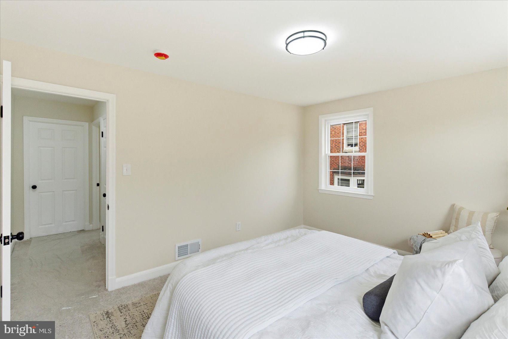 10 Mardrew Road Baltimore, MD 21229 - Photo 24 of 37 a bedroom with a bed and a window