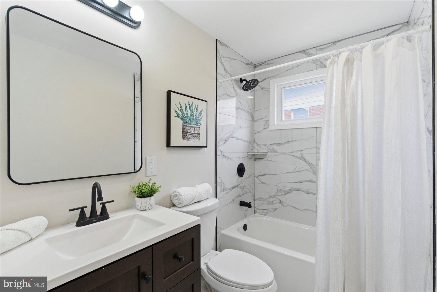 10 Mardrew Road Baltimore, MD 21229 - Photo 27 of 37 a bathroom with a sink toilet and shower