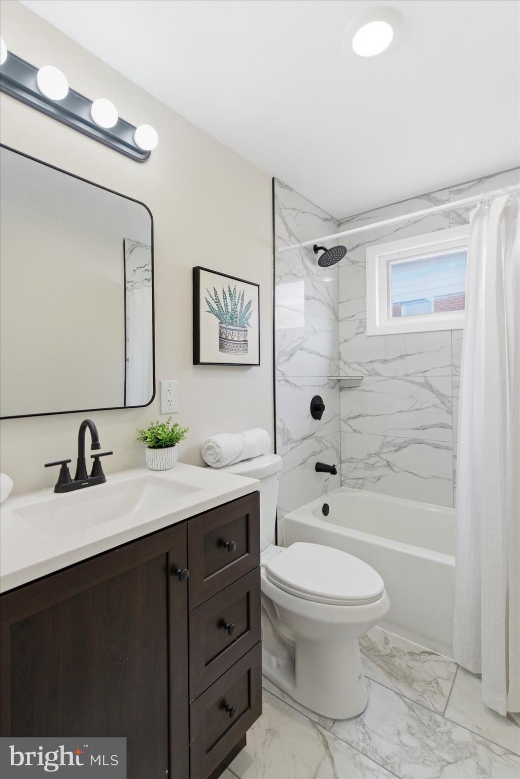 10 Mardrew Road Baltimore, MD 21229 - Photo 28 of 37 a bathroom with a sink a toilet and shower