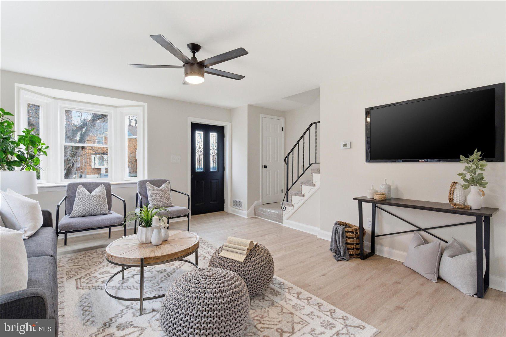 10 Mardrew Road Baltimore, MD 21229 - Photo 8 of 37 a living room with furniture and a flat screen tv