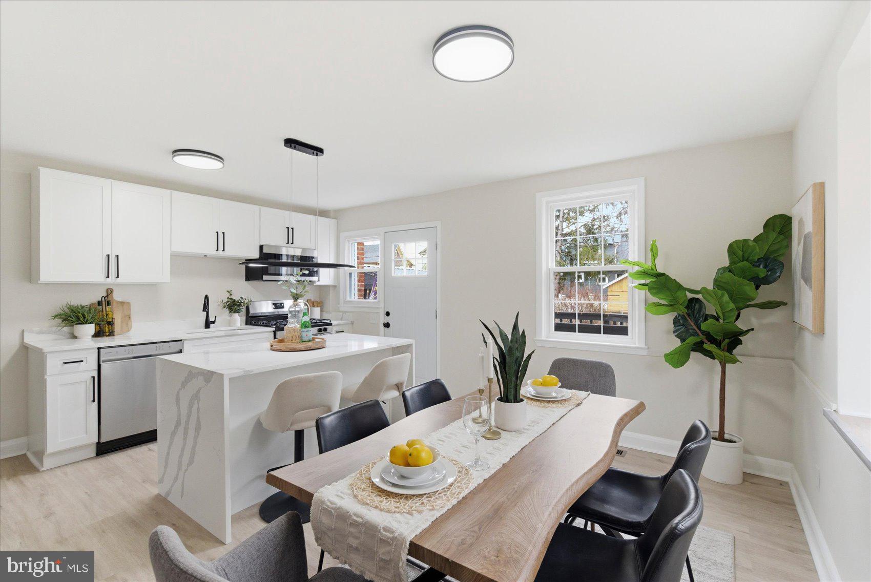 10 Mardrew Road Baltimore, MD 21229 - Photo 9 of 37 a kitchen with a table and chairs in it