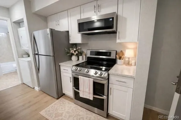 a kitchen with a stove and a microwave