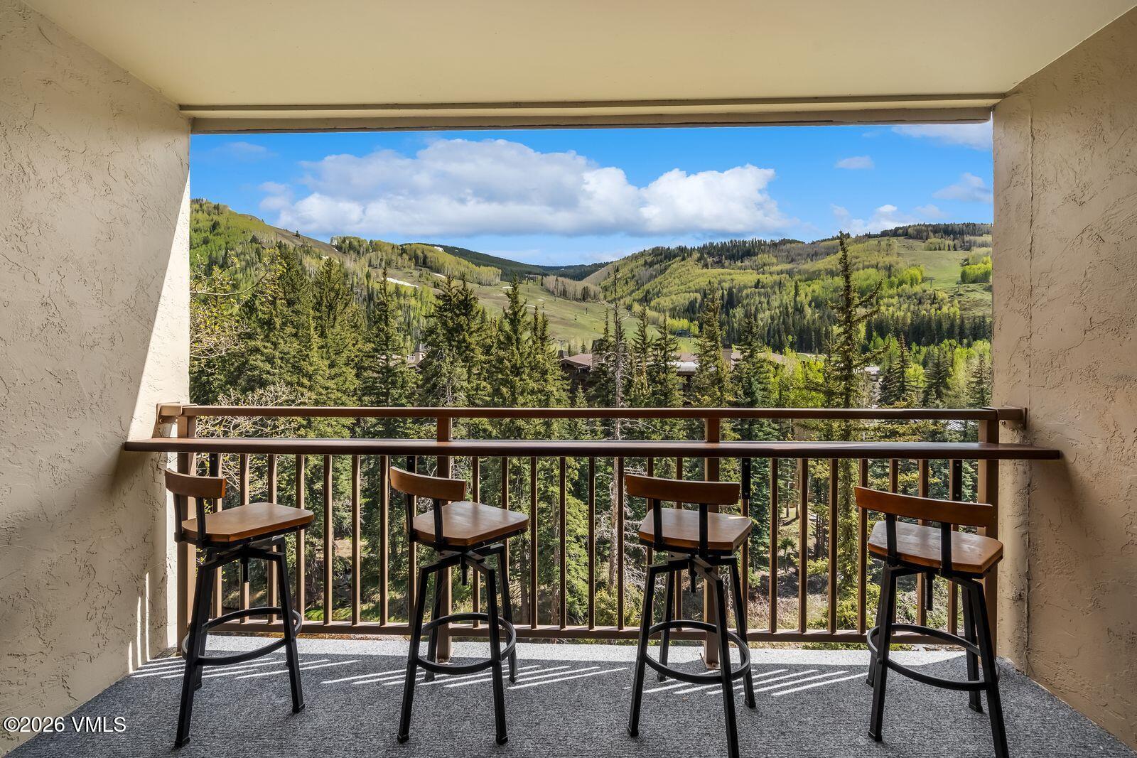 500 South Frontage Road East, Unit 308 Vail, CO 81657 - Photo 16 of 25 a view of a chairs and table in a window