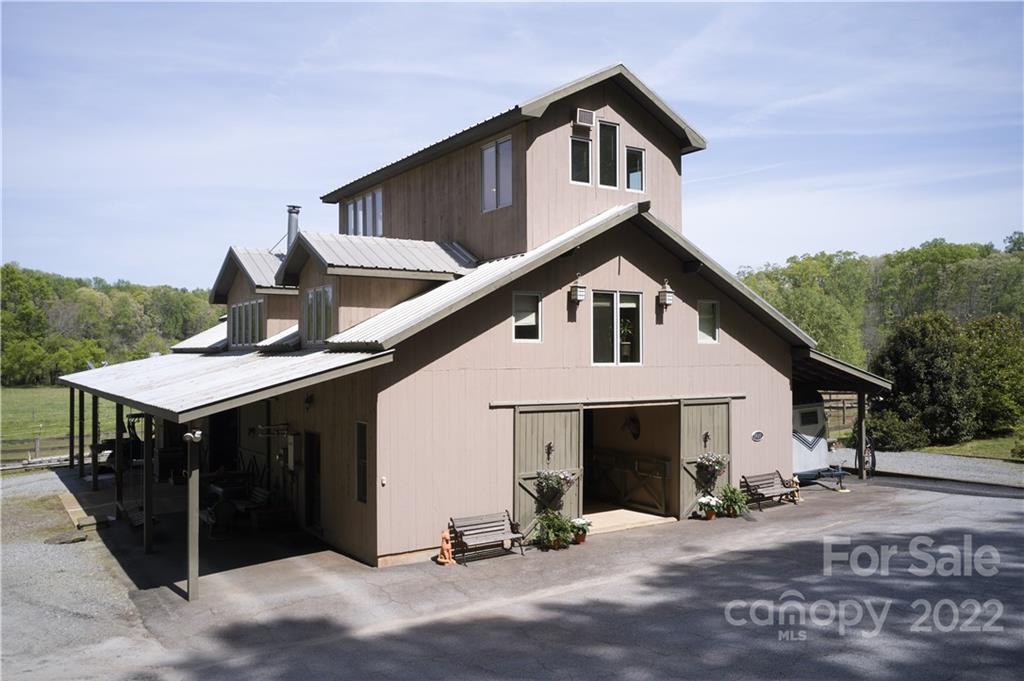 5521 Hunting Country Road Tryon, NC 28782 - Photo 6 of 45 a front view of a house with garage
