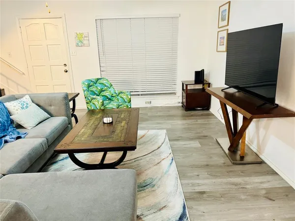 a living room with furniture and a table
