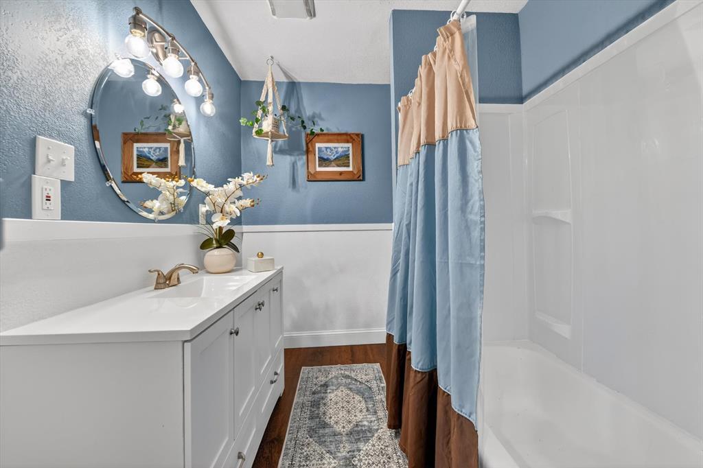 1808 Silver Creek Azle Road Azle, TX 76020 - Photo 20 of 32 a bathroom with a sink and a mirror
