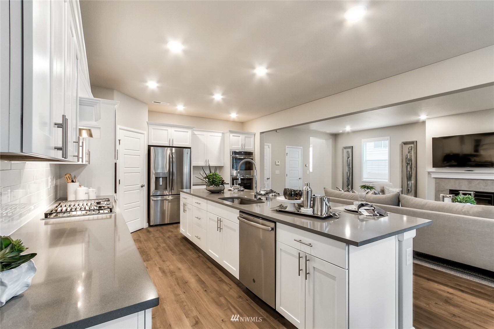 4118 235th Place Southeast, Unit 47 Bothell, WA 98021 - Photo 11 of 17 a kitchen with stainless steel appliances granite countertop a sink stove and refrigerator