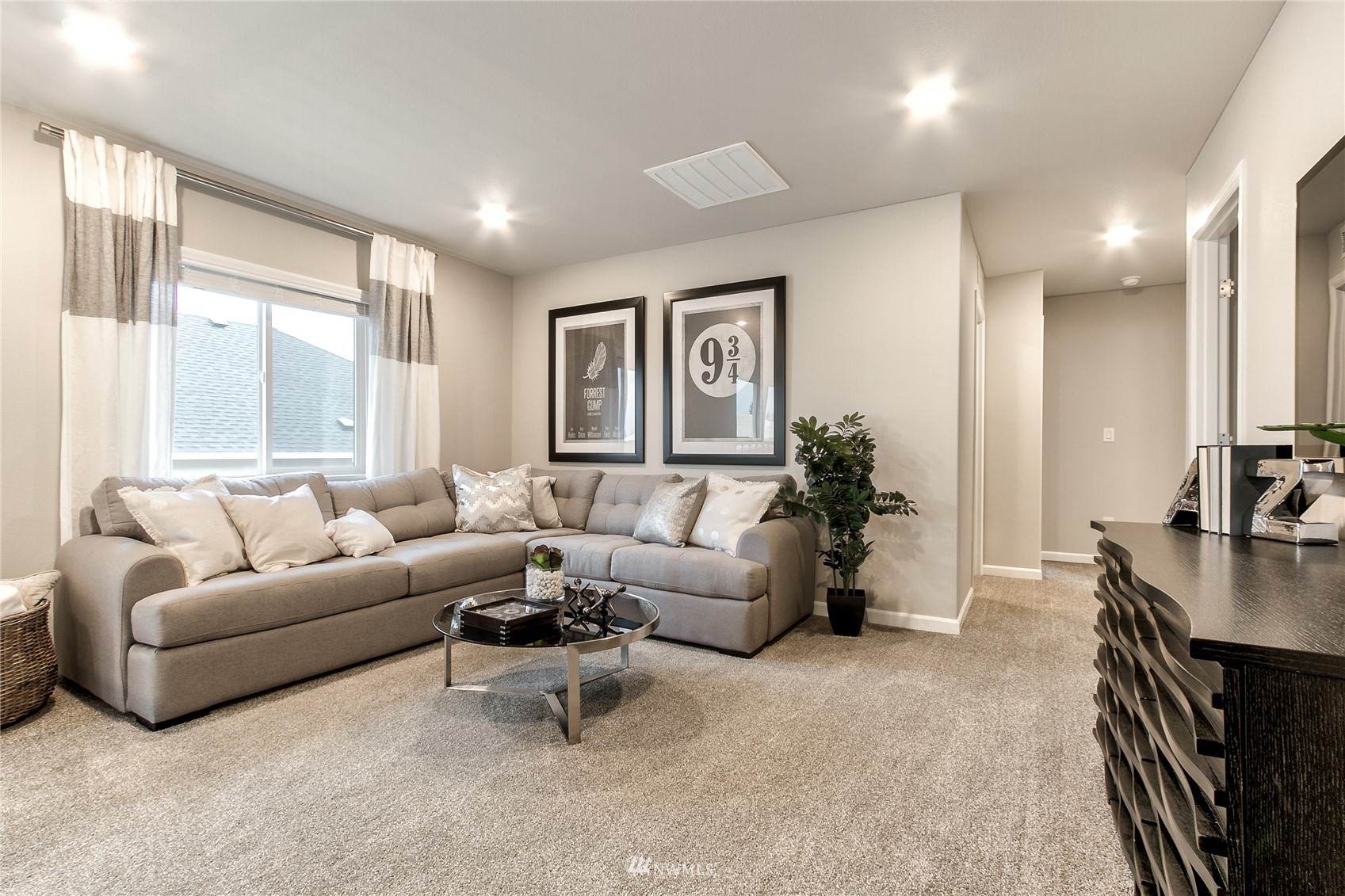 4118 235th Place Southeast, Unit 47 Bothell, WA 98021 - Photo 14 of 17 a living room with furniture and large windows