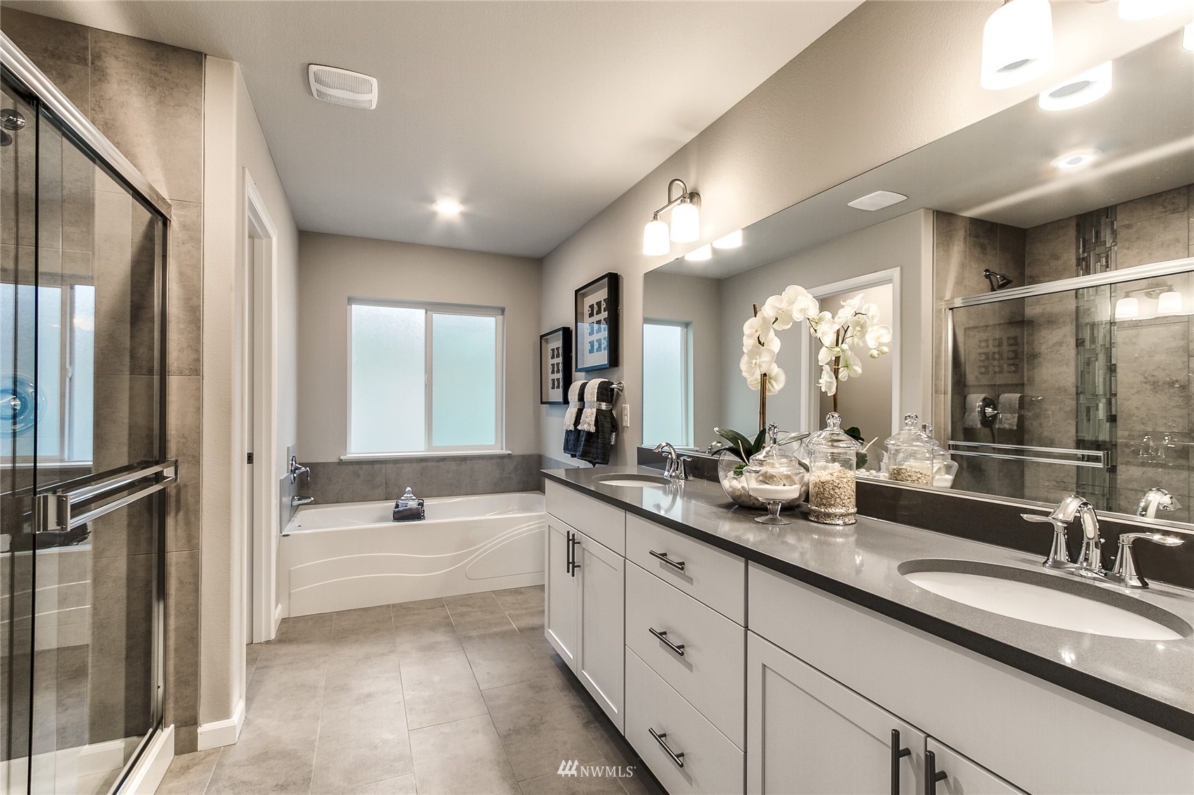 4118 235th Place Southeast, Unit 47 Bothell, WA 98021 - Photo 15 of 17 a spacious bathroom with a double vanity sink mirror and double