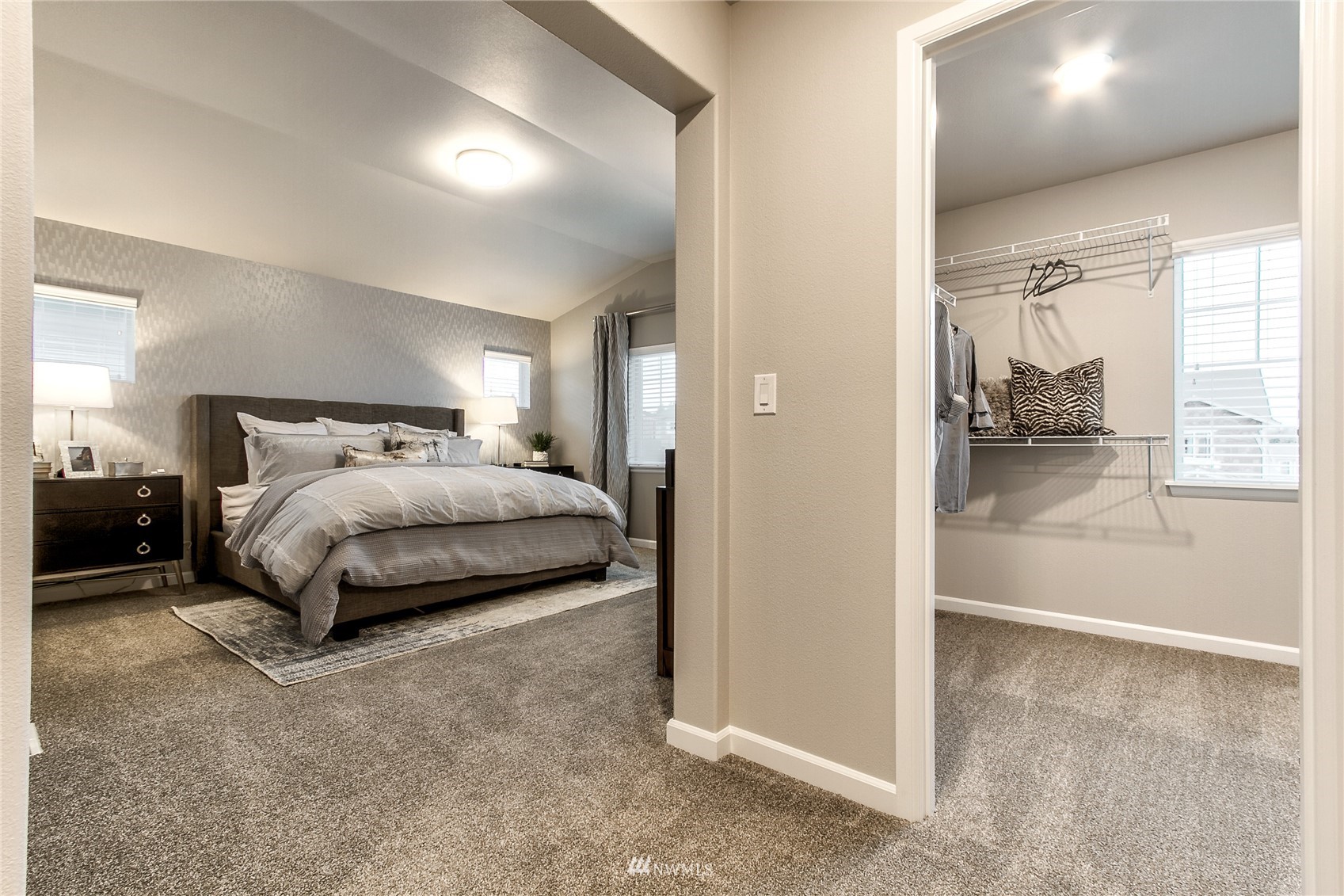 4118 235th Place Southeast, Unit 47 Bothell, WA 98021 - Photo 16 of 17 a spacious bedroom with a bed and a cabinets