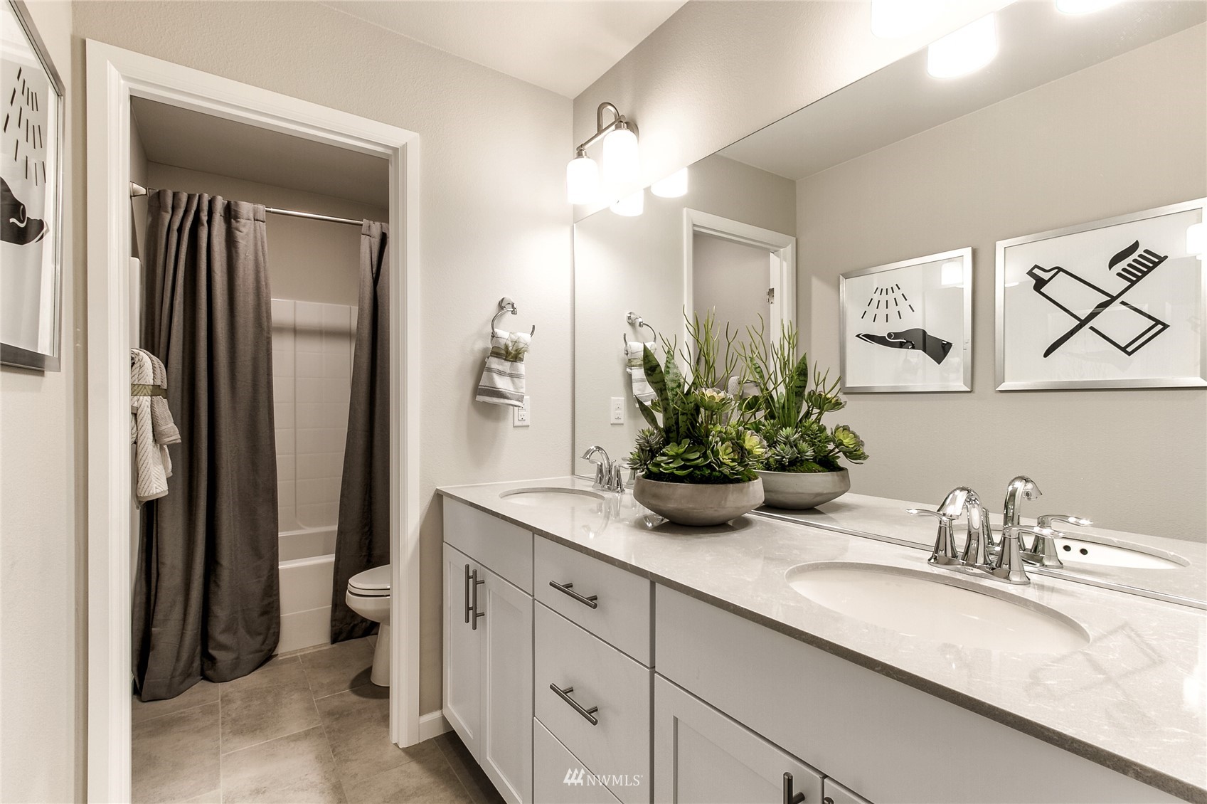 4118 235th Place Southeast, Unit 47 Bothell, WA 98021 - Photo 17 of 17 a bathroom with a granite countertop sink a mirror and a shower