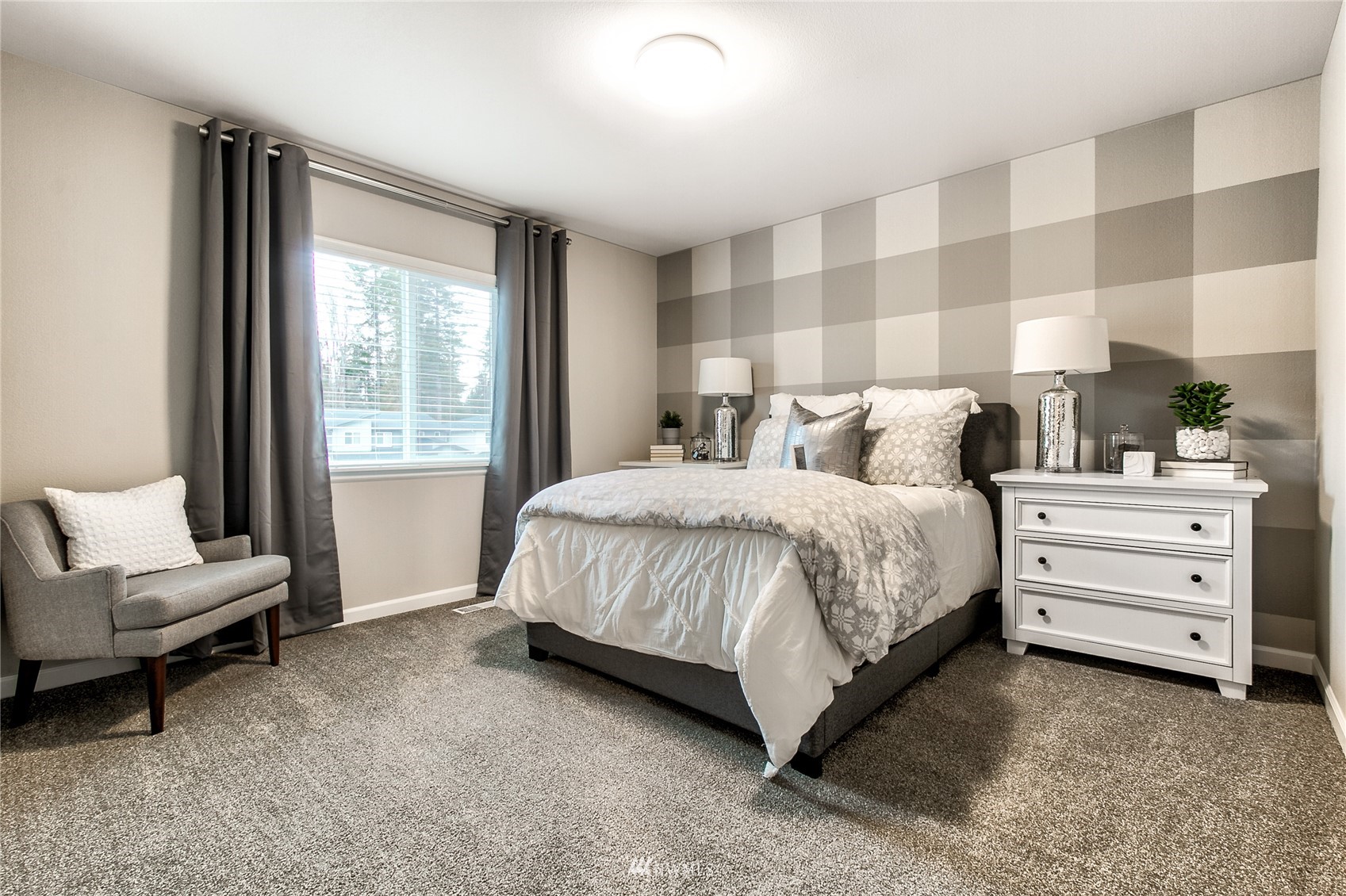 4118 235th Place Southeast, Unit 47 Bothell, WA 98021 - Photo 5 of 17 a bedroom with a bed and a couch