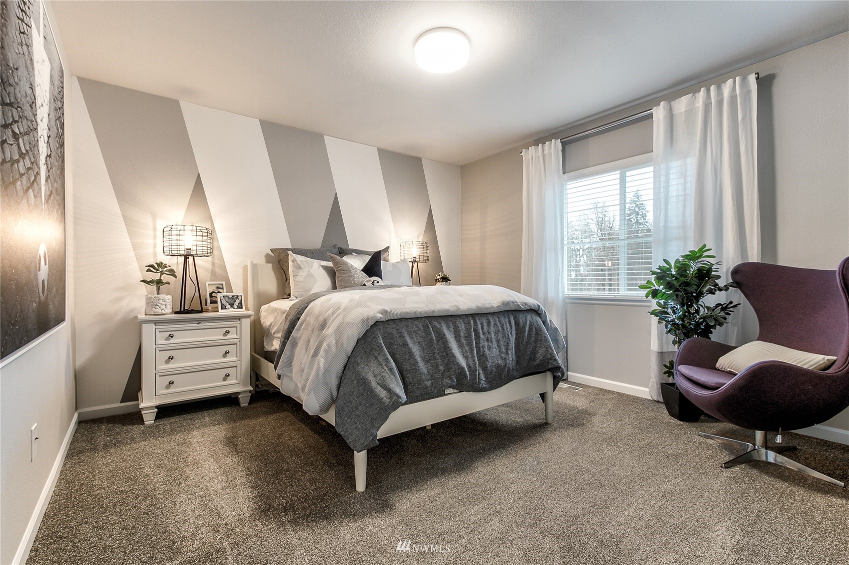 4118 235th Place Southeast, Unit 47 Bothell, WA 98021 - Photo 6 of 17 a bedroom with a bed and windows