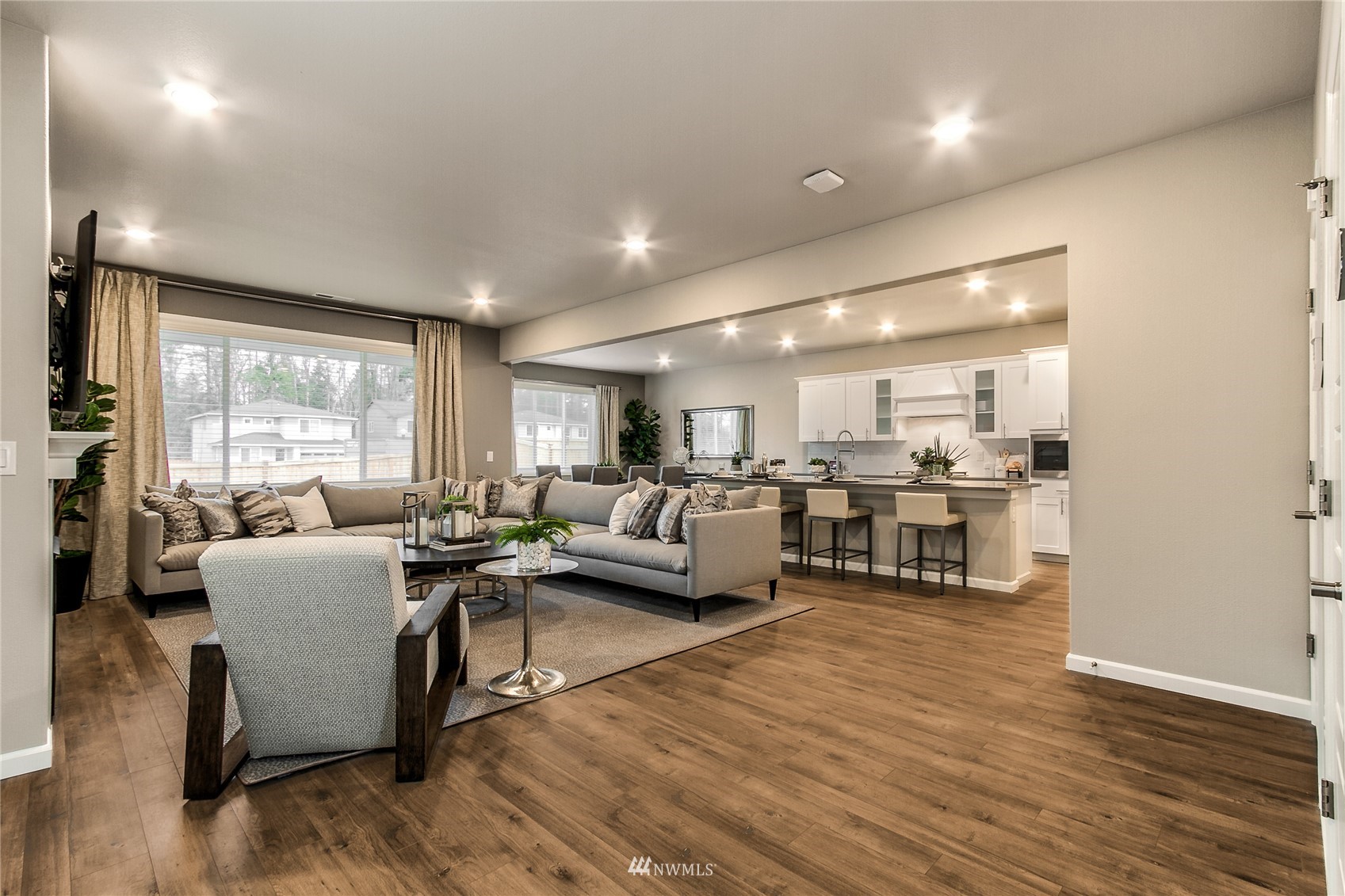 4118 235th Place Southeast, Unit 47 Bothell, WA 98021 - Photo 8 of 17 a living room with furniture wooden floor and a large window