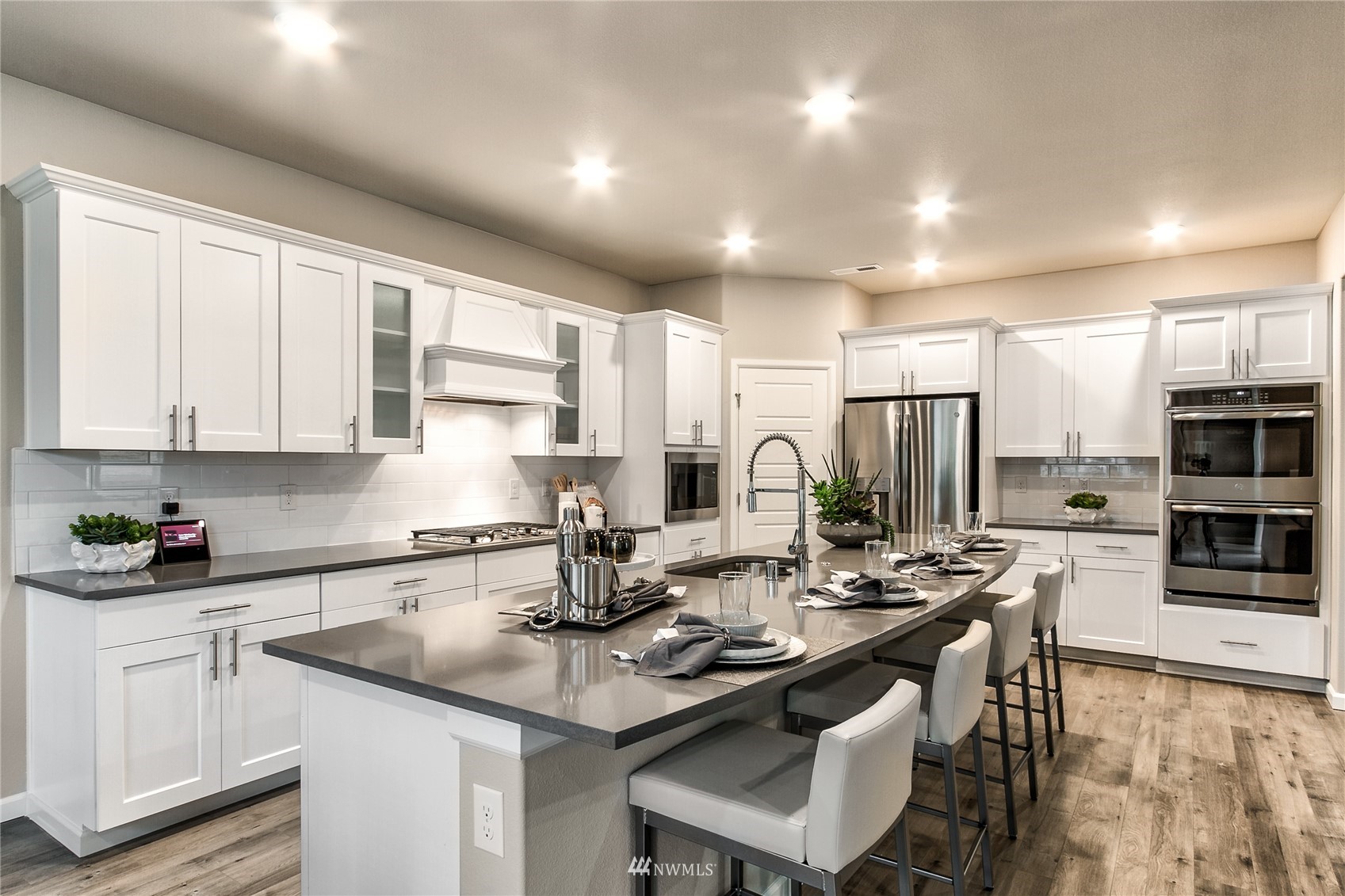 4118 235th Place Southeast, Unit 47 Bothell, WA 98021 - Photo 10 of 17 a kitchen with stainless steel appliances kitchen island granite countertop a sink and cabinets