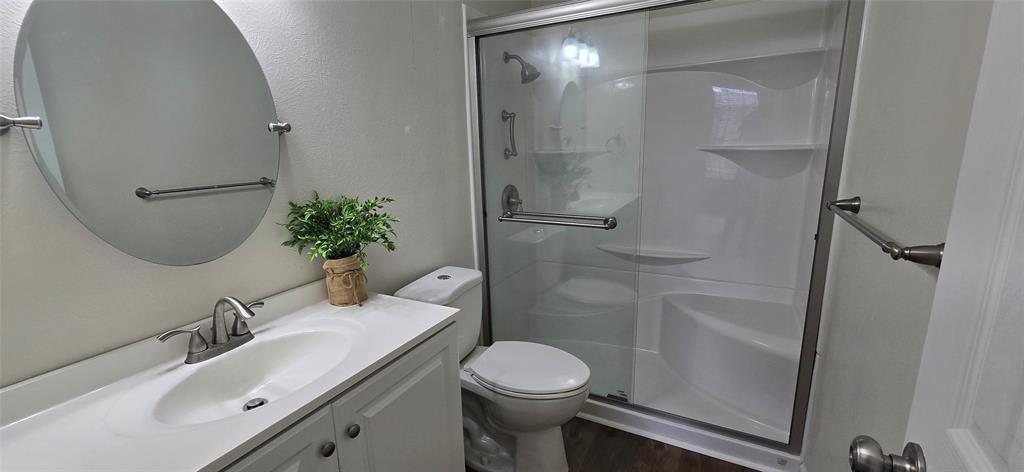 4484 Chaha Road, Unit 103 Garland, TX 75043 - Photo 10 of 13 a bathroom with a sink toilet and shower