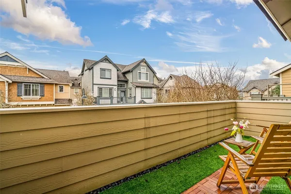 a backyard of a house with table and chairs